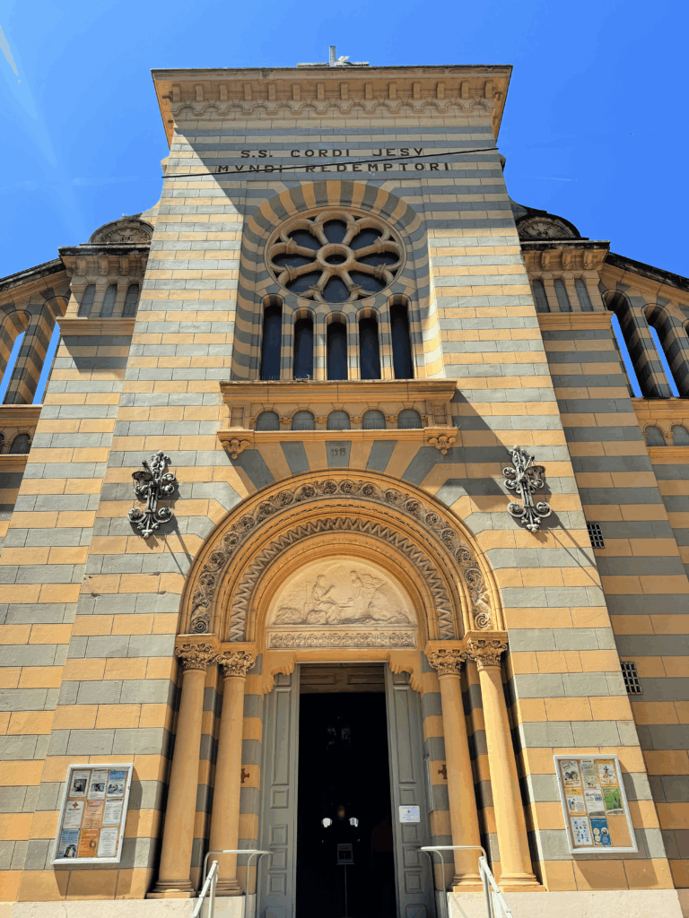 Façade of the Église du Sacre Coeur, Menton, France (copyright gscinparis, LLC)