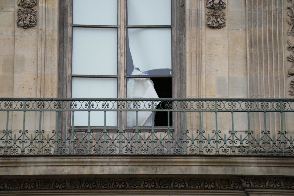 Broken window of the Louvre Museum in Paris, France on Sunday, October 19, 2025