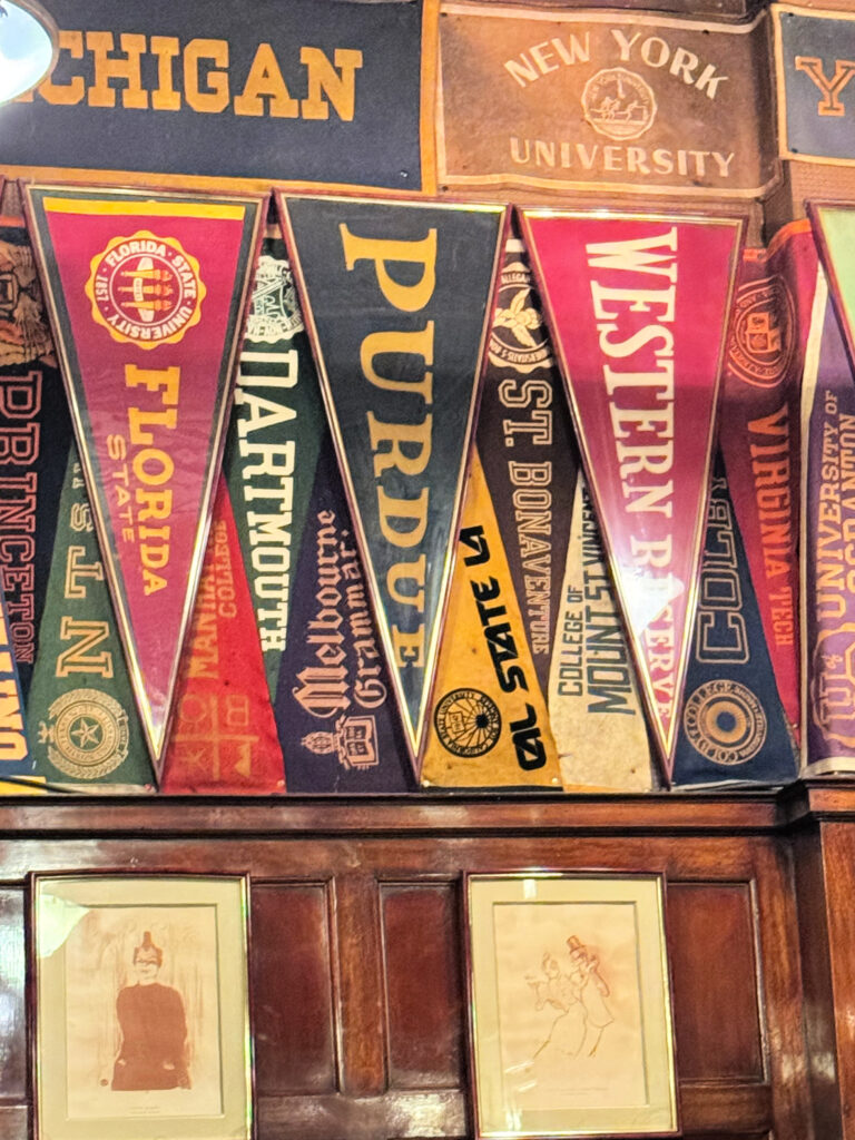 College spirit adorns the walls at Harry's Bar in Paris